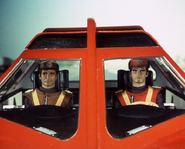 Scarlet and Brown in their Spectrum Saloon Vehicle, before their death