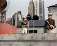 The guards stationed on top of the nearby rooftops