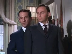 Victor (right) invades Max's apartment.