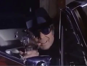 James Komack as the gunman in "The Little Black Book".