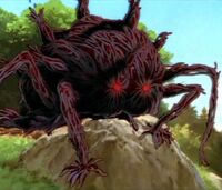 Der achtbeinige Dämon Nago schaut auf das Dorf