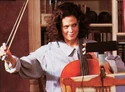 Still of Dana playing cello, seen in Ghostbusters II: Storybook