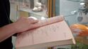 Script Supervisor's copy in display case at Ghost Corps, seen in Tested YouTube 11/23/21