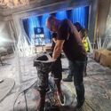 SFX team sets up frozen adventurers in ballroom set (Credit: Alex Vlcek)