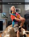 Logan Kim on tortoise statue wearing bald cap during Frozen Empire filming (Credit: Logan Kim)