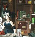 Behind Kylie Griffin on shelf in Ghostbusters Issue #5