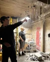 Gil Kenan in frozen Firehouse basement set during Frozen Empire production (Credit: Jason Reitman)