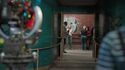 Filming cast entering lab (Credit: FilmInk Magazine)