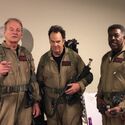 Bill Murray, Dan Aykroyd, and Ernie Hudson suited up in hallway (Credit: Belle Aykroyd)