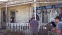 Carrior Coon filming a scene on Farmhouse set exterior, seen in Tested YouTube 8/3/21
