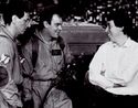 Harold Ramis, Dan Aykroyd, and Ivan Reitman relax on temple set between shots, seen in Making Ghostbusters p.182