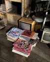 Stacks of old 1984 The Atlantic, Omni, and Time magazines at Firehouse attic set at Farnborough Film Studios during Ghostbusters: Frozen Empire production (Credit: Jason Reitman)