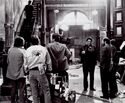 Ivan Reitman, Joe Medjuck filming in decrepit Firehouse, Harold Ramis coming down stairs, seen in Making Ghostbusters p.39