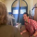 Paul Rudd and Carrie Coon riff in garage bay of Firehouse set during Frozen Empire filming (Credit: Finn Wolfhard)