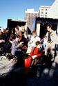 Cast between takes sitting on chairs outside Firehouse