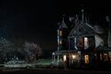 Still of Ecto-1 parked outside the Farmhouse at night 6/8/2021 (Credit: IGN)