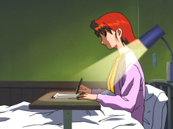 Kayako writing a letter to her family before she died.