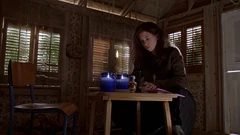 The interior of the shed. Note the trees directly outside of the windows, which are not present on exterior shots since this scene was shot in a studio.