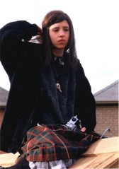 In this photo we see that Brigitte was actually sitting on the roof when taking photos of Ginger in the picket fence