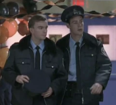 Two police officers in a deleted scene in the high school's hallway.