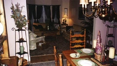 Living room.jpg (42 KB) This shot of the living room shows the second couch on the wall and the armchair