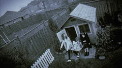 Vlcsnap-2025-09-25-21h59m11s416.png (2.51 MB) The "tea party" photo. Note the white picket fence that is missing in later shots of this area.