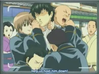 Hijikata being strangled by Sougo during a scuffle in front of TV crew in Episode 8