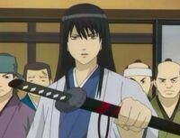 Katsura with his trademark long hair.