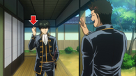 Kondou waving to Hijikata who is holding a battery in Episode 267