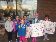 22894438 10212721668669262 8699994701706414490 n.jpg (94 KB) Samantha and Troop 138 in their nut/candy sale
