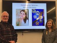 Melissa's parents Patricia and Michael in front of a screen