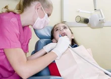 Dental hygienist working with a patient