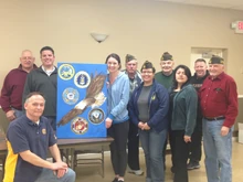 Melissa with local veterans and painting that proudly hangs up in the Lynbrook VFW