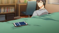 Ritsuka looking at the text on his bed