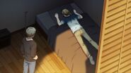 Akihiko looking at Haruki laying on the bed