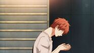 Mafuyu looking down at his hands