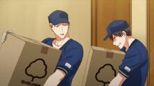 Akihiko and Ritsuka carrying boxes