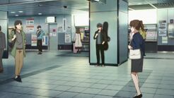 Ritsuka looking at his phone at the station