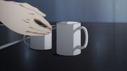 Akihiko grabs his mug