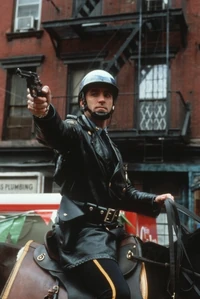 Vincent Mancini, disguised as a mounted policeman, terminates Joey Zasa.