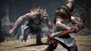 Kratos faces up against an Ogre.