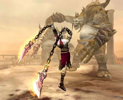 Kratos engaging a Cyclops Desert King in battle.
