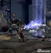 Kratos petrifying the Cyclops with the Medusa's Gaze.