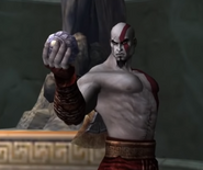 Kratos with the Amulet of the Fates.