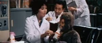 Infant Sanda being fed by Akemi Togawa