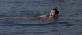 Saeko swimming when she is spotted by Goro Maki