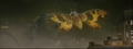 Mothra attacks Godzilla with scales