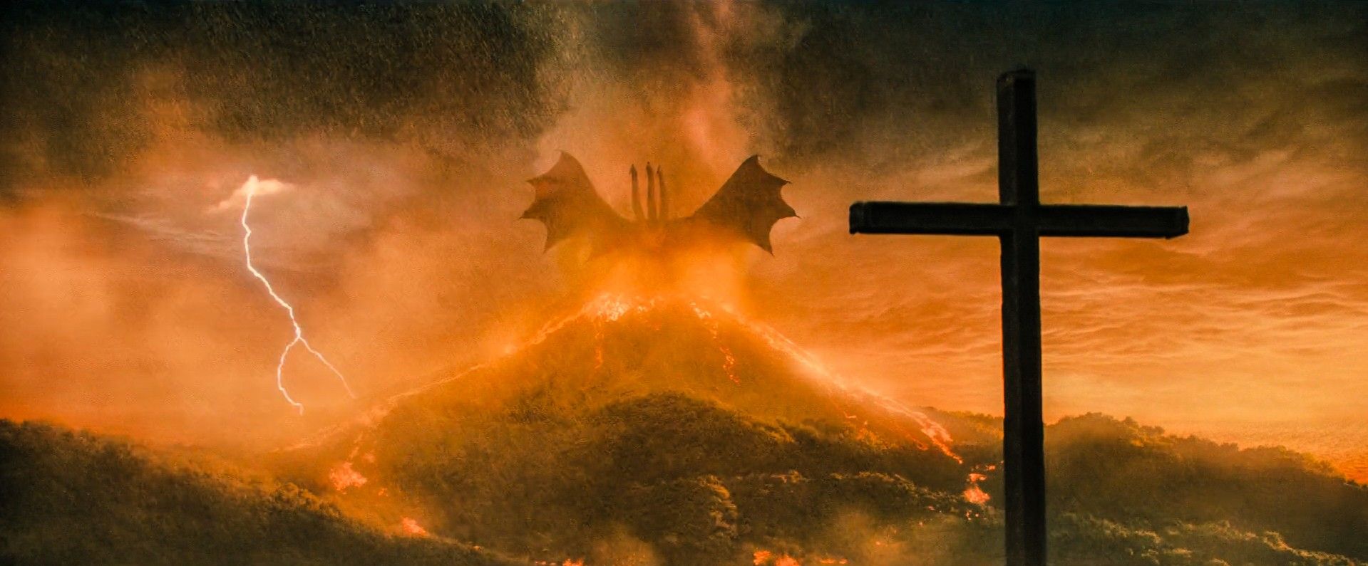 What is the symbolism behind King Ghidorah roaring in front of the Cross? :  r/Monsterverse