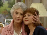 Kate and her mother, discussing about whether to invite Stan or not.