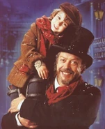Ebenezer Scrooge and Tiny Tim in A Christmas Carol.